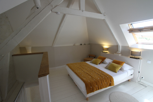 Bed in cottage bedroom at la Haute-Flourie in Saint-Malo